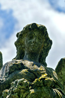 Female Angel Sculpture Holding Flowers