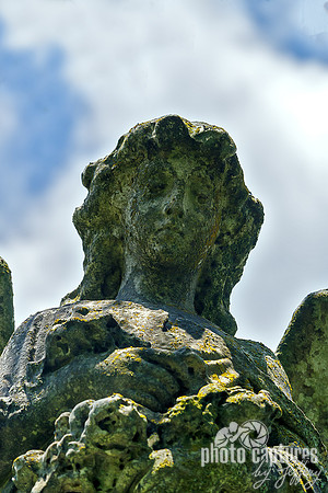 Female Angel Sculpture Holding Flowers