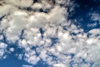 White Puffy Clouds Against Blue Sky