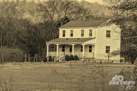 Rural Two Story Farmhouse in Sepia Tone