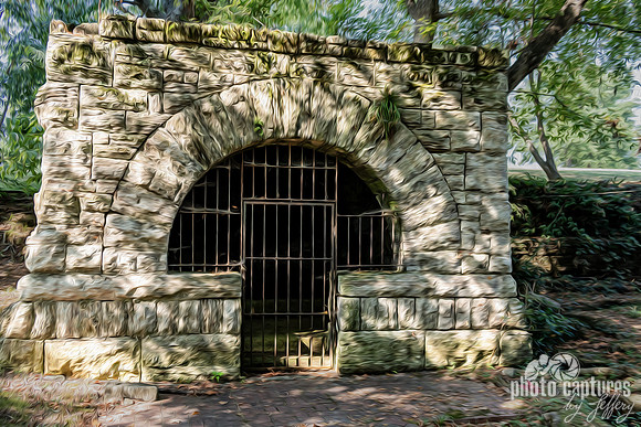 Historic stone arch and barred entrance Spring House artistic rendering