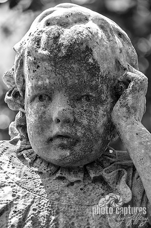 Black and white portrait of a little girl sculpture