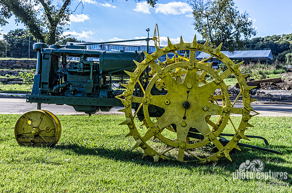 Yellow Spiked Wheel Tractor