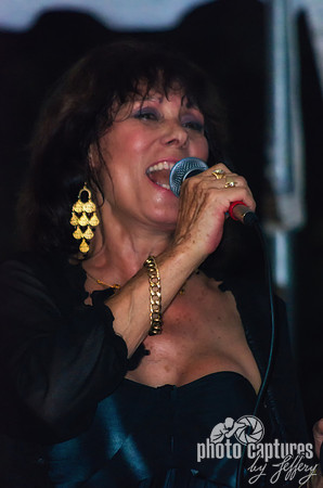 Singer Leading The Dancers In Song Greek Festival
