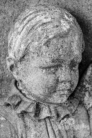 Black and white child sculpture carved in headstone