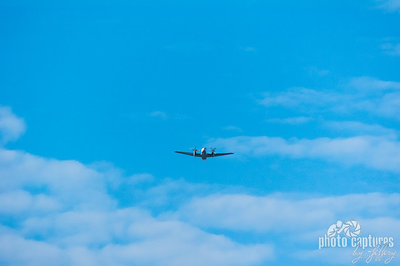 Twin prop plane in flight