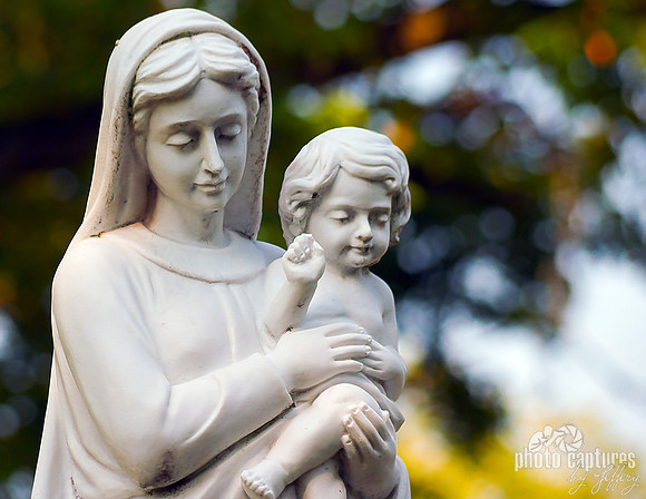 Mother Mary holding baby Mr Bean