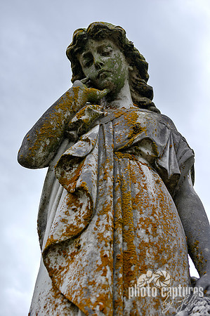 Elegant female sculpture hand to face Maplewood Cemetery