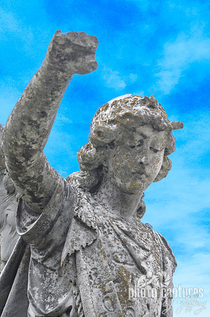 Fist in air male sculpture Maplewood Cemetery