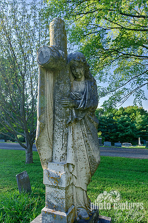 Female sculpture wood log cross