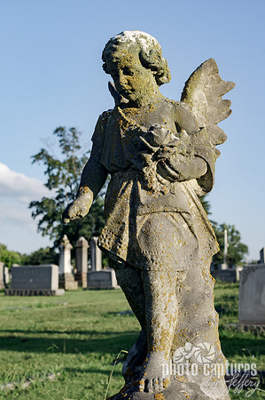Child angel one wing showing