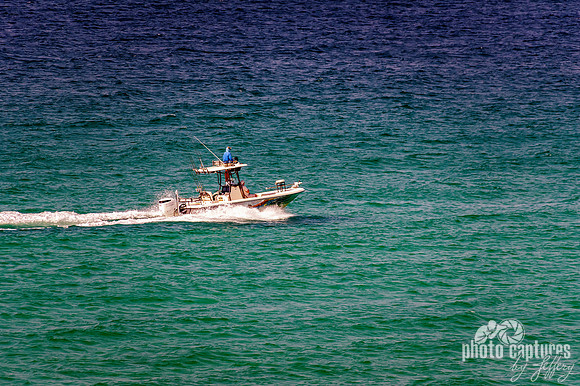 Fishing Boat Across The Ocean