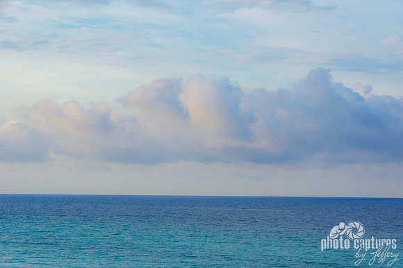 Blue Ocean Water Blue Clouds In Sky - Unframed Matted Print