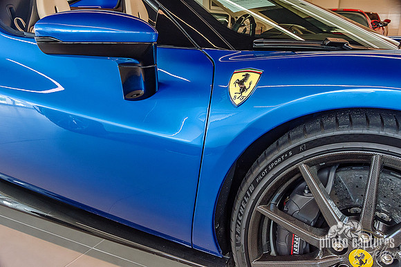 Blue Ferrari Front Side Tire View