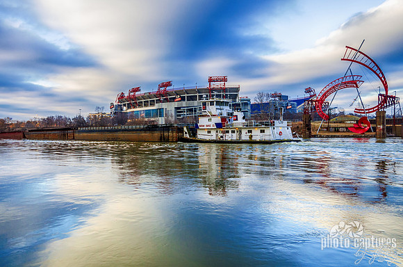 Tug Boat Moving Past LP Field On The Cumberland River Nashville TN