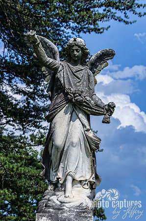 Angel with flowers in garment
