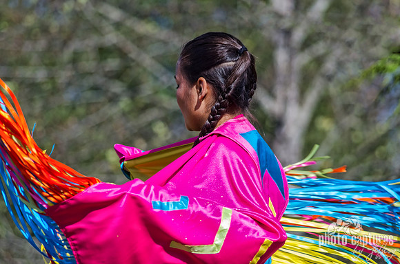 Bright pink Fancy Shawl dancer NAIA Powwow