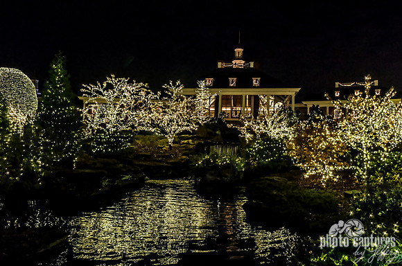 Holiday lights reflected in fountain a Country Christmas