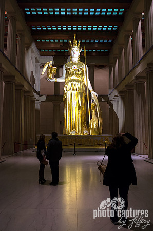 Tourists Dwarfed In The Height Of Athena
