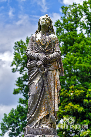 Female Sculpture Hands Resting on Anchor Front View